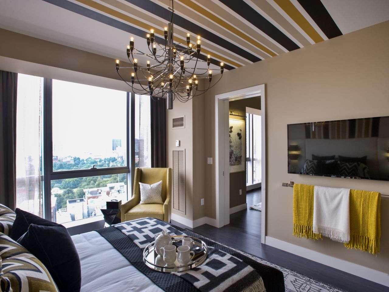 Bedroom urban master hgtv oasis condo chandelier room modern accents yellow metal win designs sign gold windows boston
