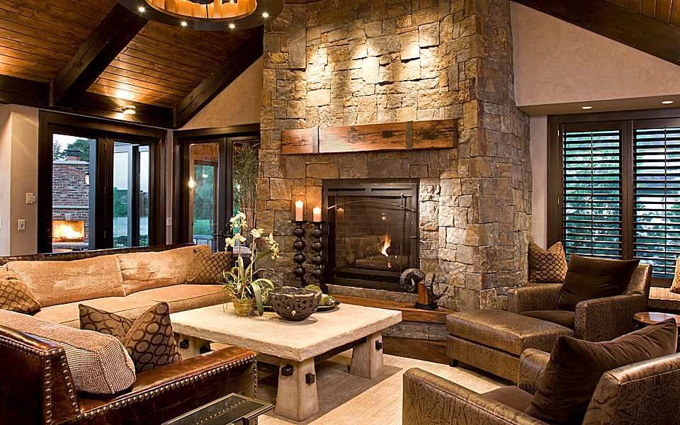 Rustic room living sophisticated designs rooms wood stone turn fireplace mountain down style won focal point great family architectureartdesigns houzz